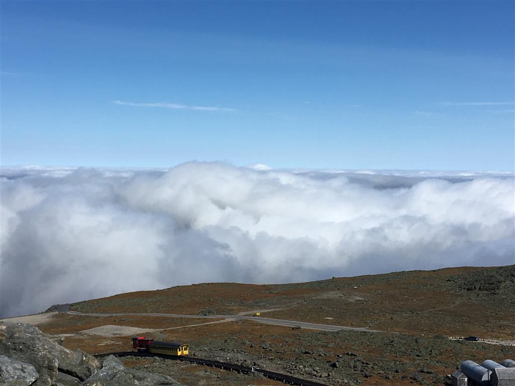 The view from the summit of Mt Washington, with the chain-driven train