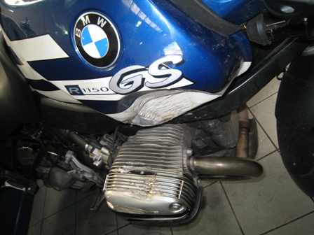Damage to my bike, with big dent in tank and crushed engine