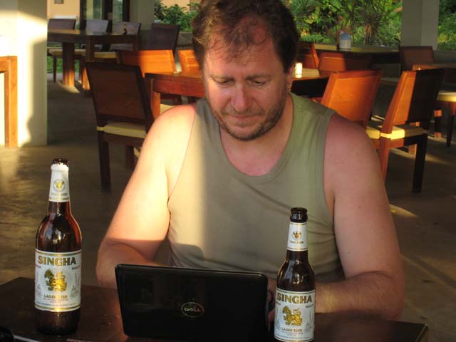 Paul updates the blog, with a beer for each hand...