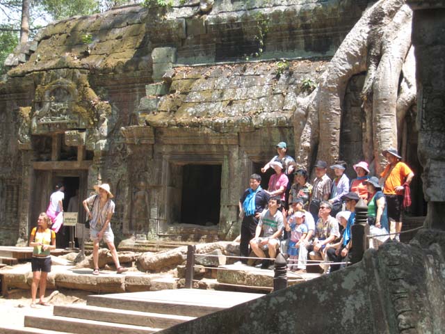 The whooping Koreans get behind the barriers for that all important Ta Prohm photo...