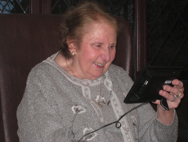 Mum enjoying the photos of us as kids on her new Christmas present