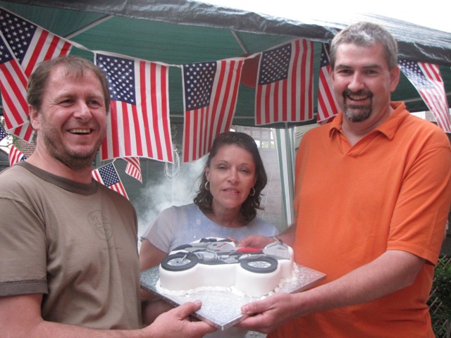 Richard, Karen and Paul pose with the cake...
