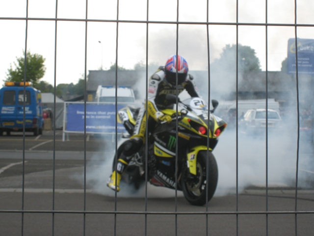 James Toseland destroys his rear tyre for the crowd