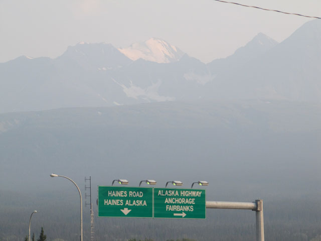 The smoke haze almost obscures the mountains from view...