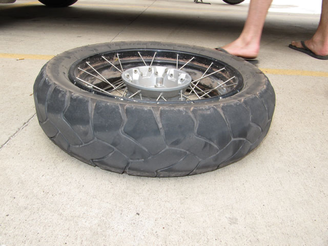 First step, remove the wheel. Notice how worn the tyre is...