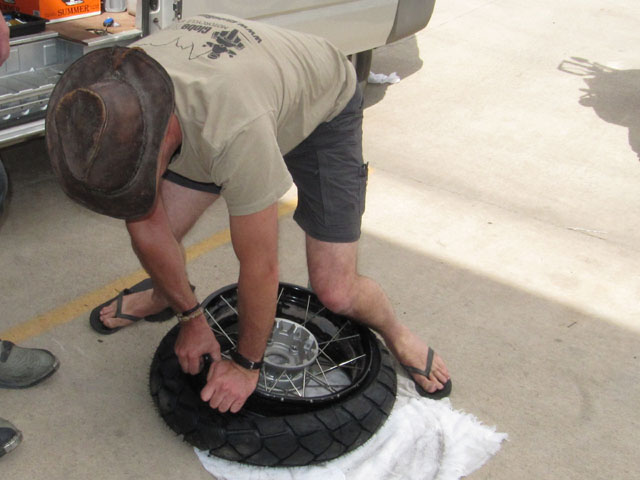 Step 6: Using more brute force and technique, fit the rim into the new tyre...