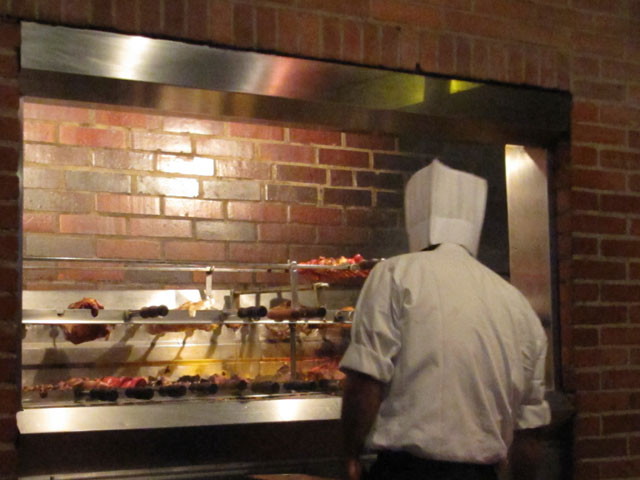 The chef at work, preparing more meat than you can shake a skewer at...