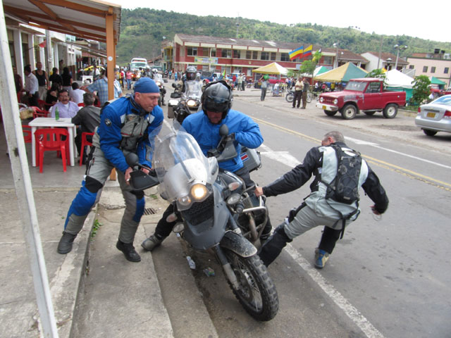 Heave... pulling Al's bike upright...