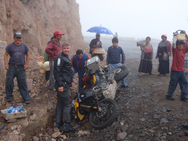 Aaron stands by his stranded bike...