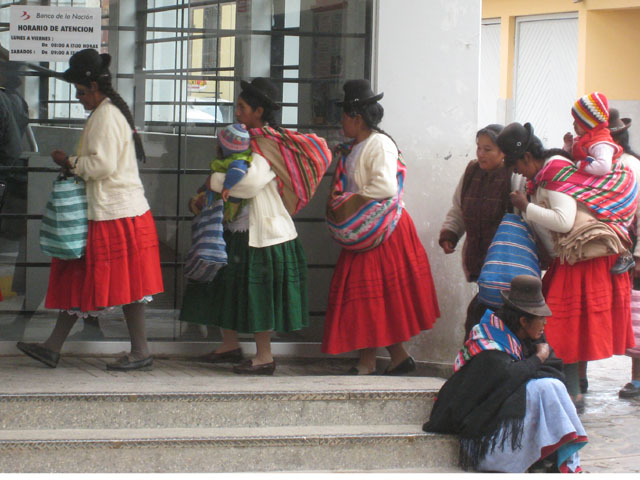 Peruvian women line up to collect their giros...