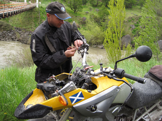 Jeff trying to resuscitate Chris's wrecked bike...